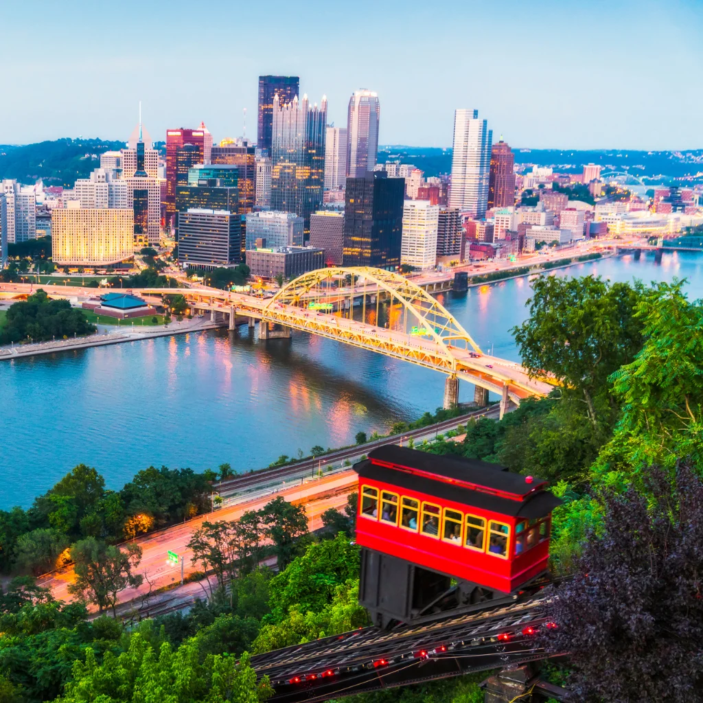 Pittsburgh skyline with the Duquesne Incline and yellow bridges at dusk. pennsylvania / Transportvibe