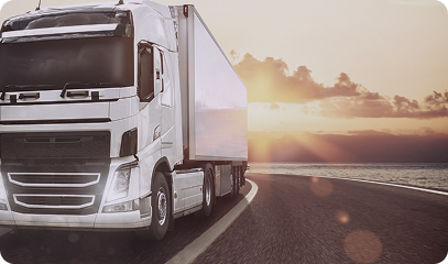 A large blue cargo ship loaded with colorful shipping containers sailing across the open sea with another vessel in the background. Transportvibe 5