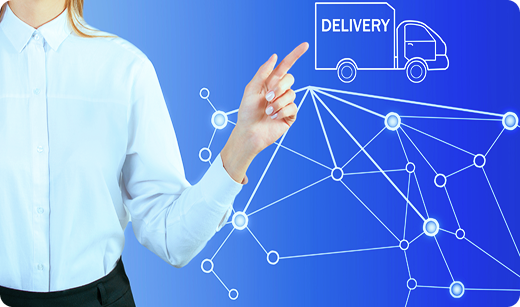 Multiple trucks with large orange shipping containers parked at a warehouse loading dock under a sunny sky. Priority Auto Shipping Transportvibe